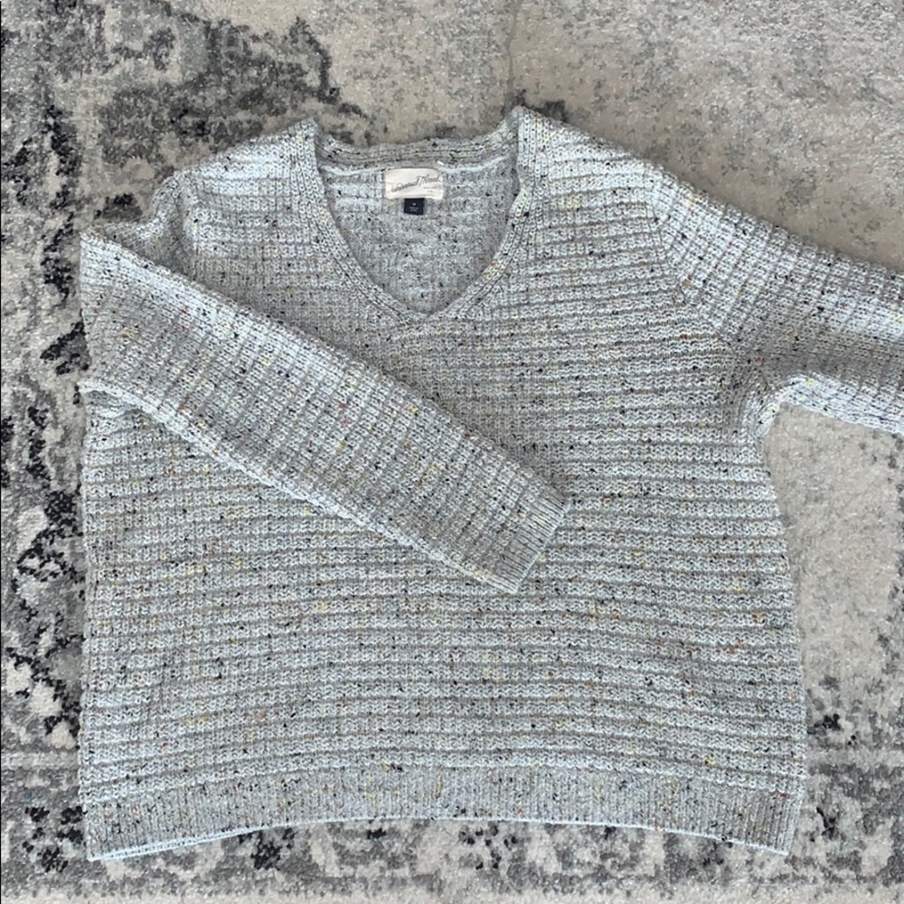 Light grey sweater.